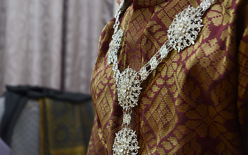 A small close-up of Peranakan-style brooches