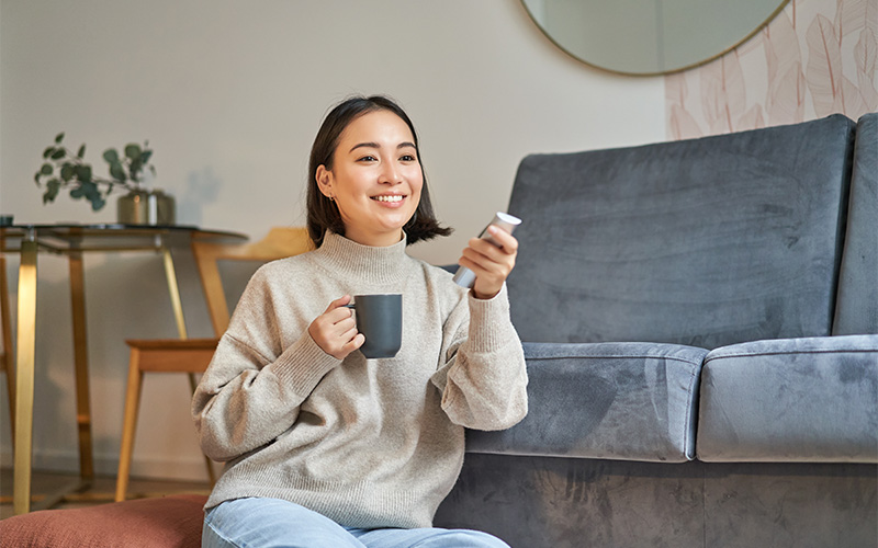 Image of a person having a leisurely cup of coffee