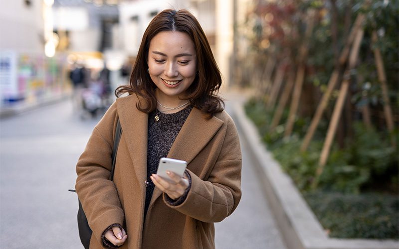 How to Spend a Weekend in Singapore Without Hitting the Same Old Spots Image of a person looking at their phone in public